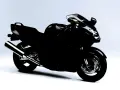 Czarny motocykl Honda CBR1100XX, sportowy turystyk, gotowy na dalekie podróże.