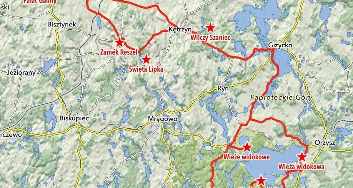 Mapa z zaznaczonymi trasami motocyklowymi na Warmii i Mazurach, z widocznymi jeziorami i nazwami miejscowości.