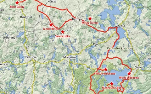 Mapa z zaznaczonymi trasami motocyklowymi na Warmii i Mazurach, z widocznymi jeziorami i nazwami miejscowości.