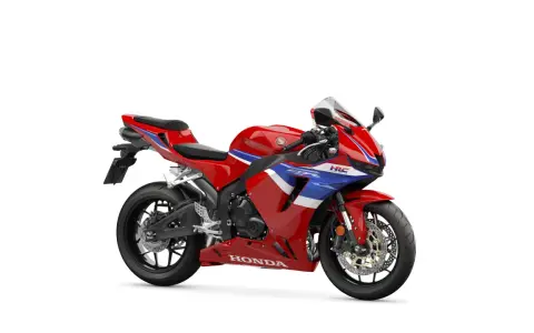 Czerwony motocykl sportowy Honda CBR 600 z niebieskimi i białymi pasami. Poznaj honda cbr 600 dane techniczne.