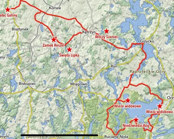 Mapa z zaznaczonymi trasami motocyklowymi na Warmii i Mazurach, z widocznymi jeziorami i nazwami miejscowości.