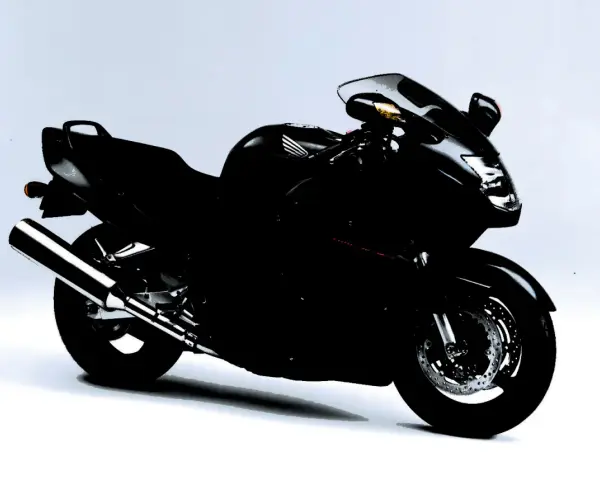 Czarny motocykl Honda CBR1100XX, sportowy turystyk, gotowy na dalekie podróże.