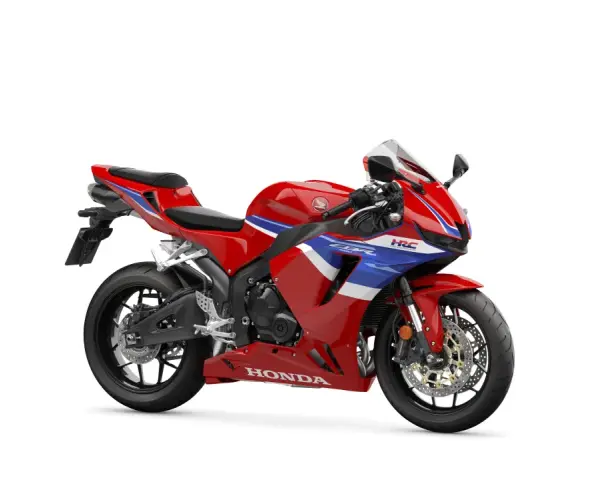 Czerwony motocykl sportowy Honda CBR 600 z niebieskimi i białymi pasami. Poznaj honda cbr 600 dane techniczne.