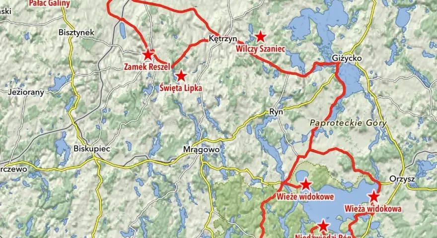 Mapa z zaznaczonymi trasami motocyklowymi na Warmii i Mazurach, z widocznymi jeziorami i nazwami miejscowości.
