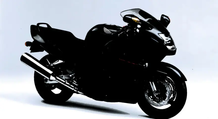 Czarny motocykl Honda CBR1100XX, sportowy turystyk, gotowy na dalekie podróże.