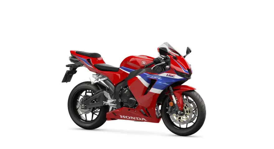 Czerwony motocykl sportowy Honda CBR 600 z niebieskimi i białymi pasami. Poznaj honda cbr 600 dane techniczne.