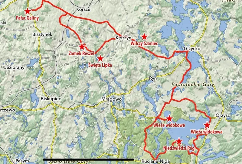 Mapa z zaznaczonymi trasami motocyklowymi na Warmii i Mazurach, z widocznymi jeziorami i nazwami miejscowości.